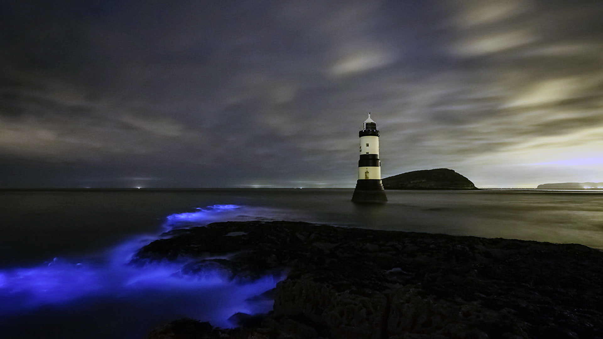 Bioluminescent plankton at Trwyn Du Lighthouse on Anglesey in Wales