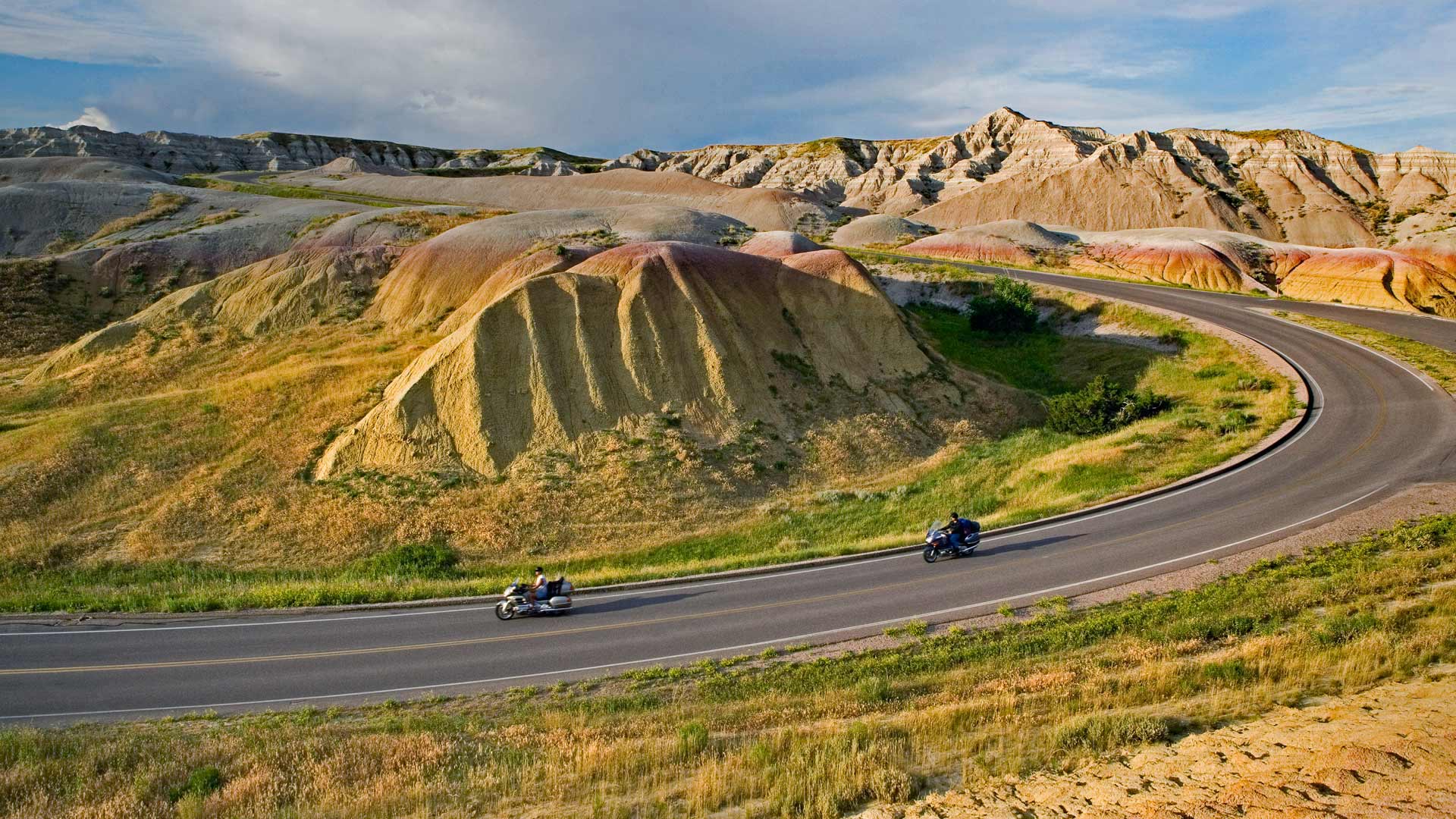 Bikers cruise South Dakota's Badlands. The Sturgis Motorcycle Rally opens Aug 3.
