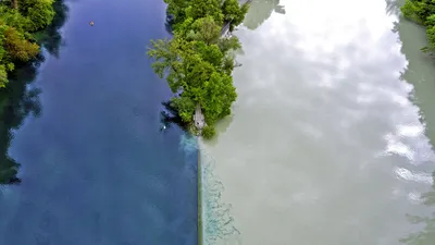 The Arve River (right) flowing into the Rhône in Geneva, Switzerland