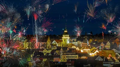 A mountain hare hunkers down in a snowstorm, the Cairngorms, Scotland